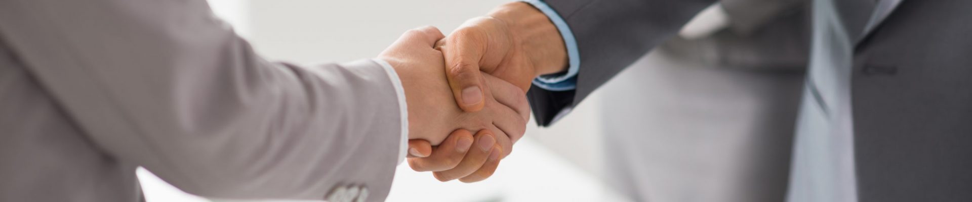Hands of business people shaking hands after successful meeting