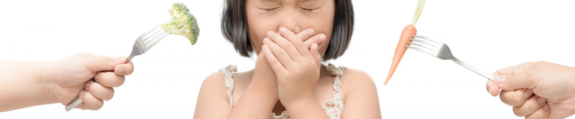 asian child girl with expression of disgust against vegetables isolated on white background, Refusing food concept