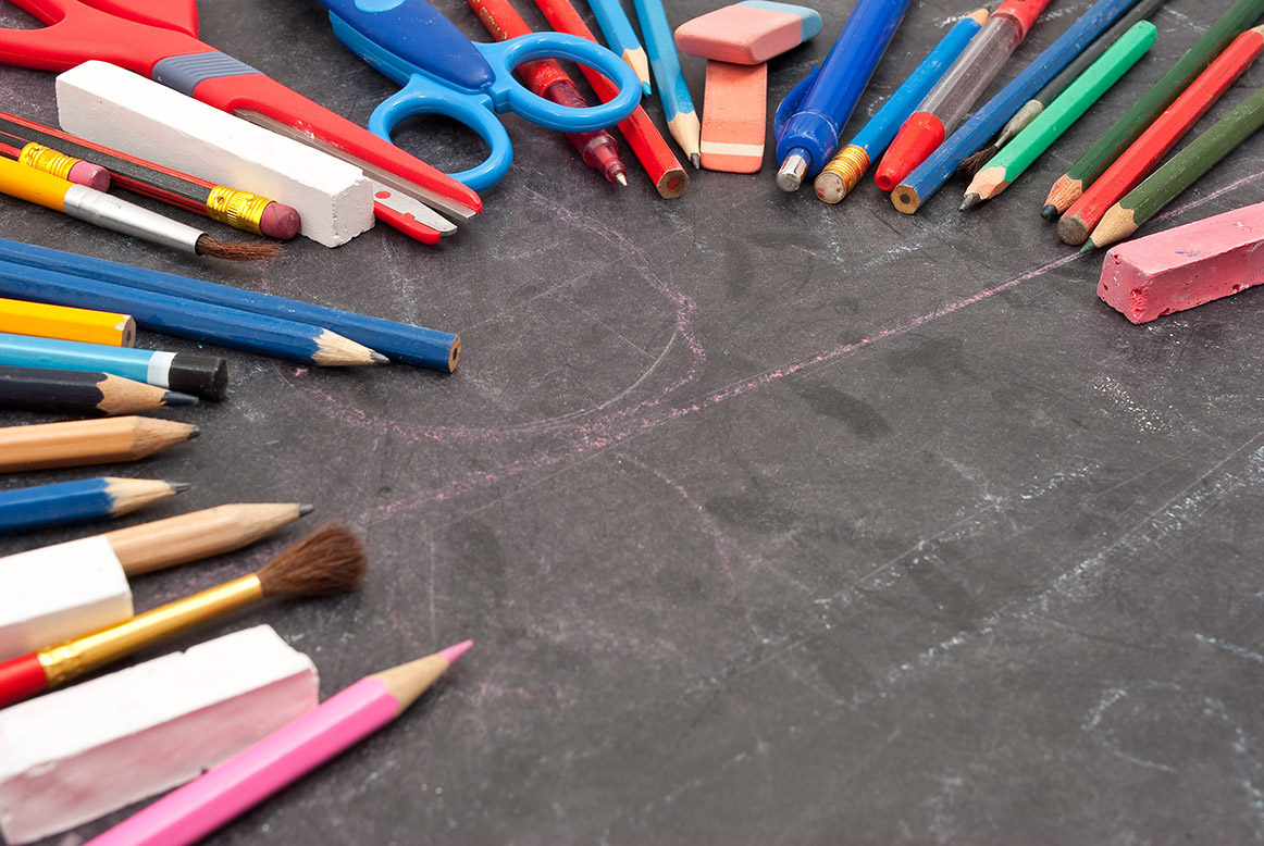 Chalkboard with school tools