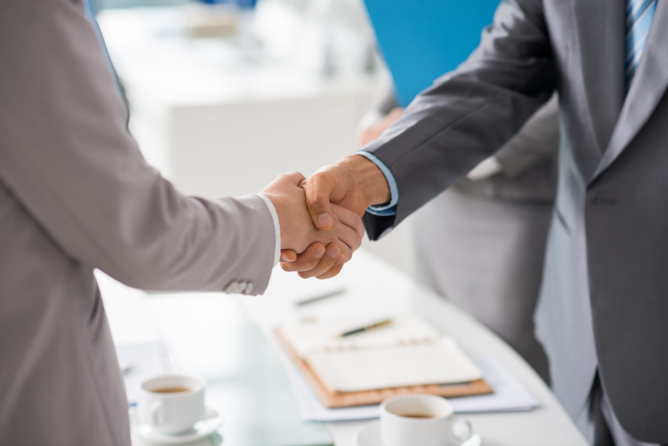 Hands of business people shaking hands after successful meeting